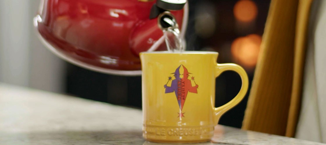 yellow mug with Weasley logo