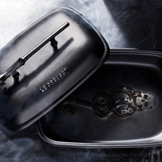 black covered casserole with the dark mark printed on the inside bottom and a sculpted elder wand as a handle for the lid