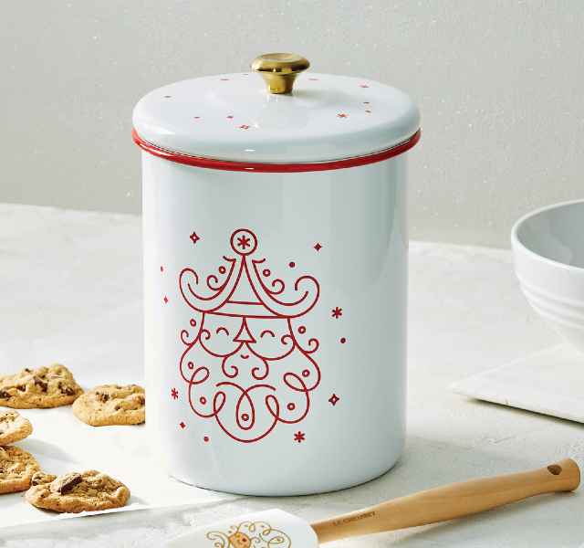 white cookie jar with santa illustration in red