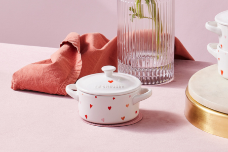 heart patterned utensil crock filled with flowers
