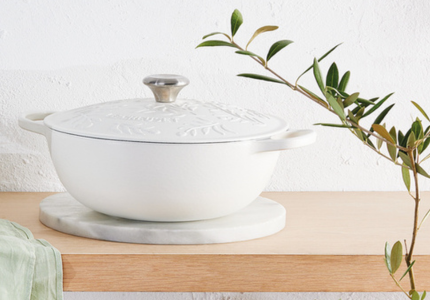 rectangular yellow covered casserole with olive branch design embossed on the lid