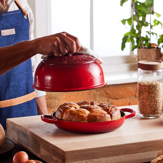 Chad Robertson works with dough in a Le Creuset bread oven