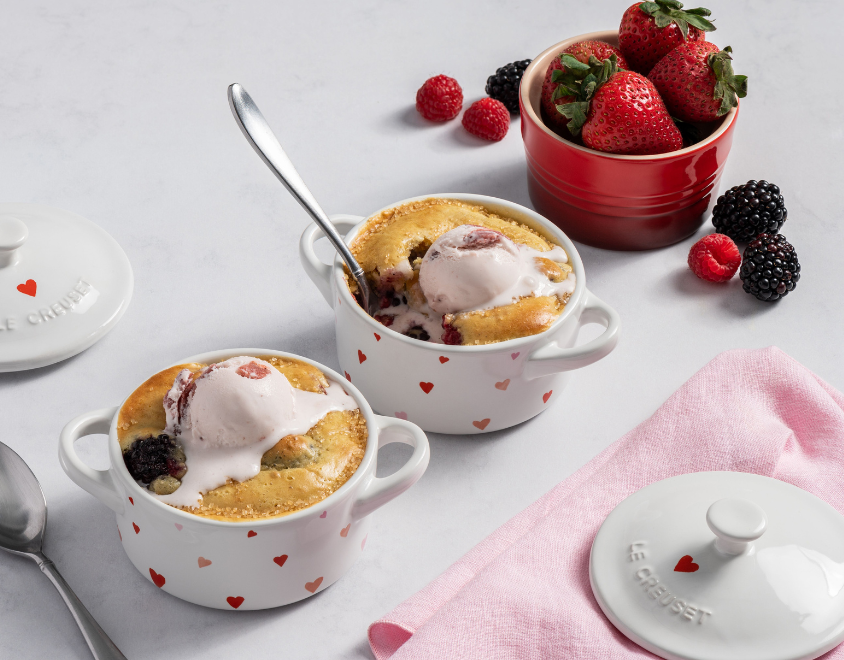 mini cocottes with printed red and white hearts filled with cobbler